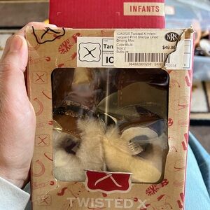 Twisted X infant leopard print Sherpa lined moccasin size 2